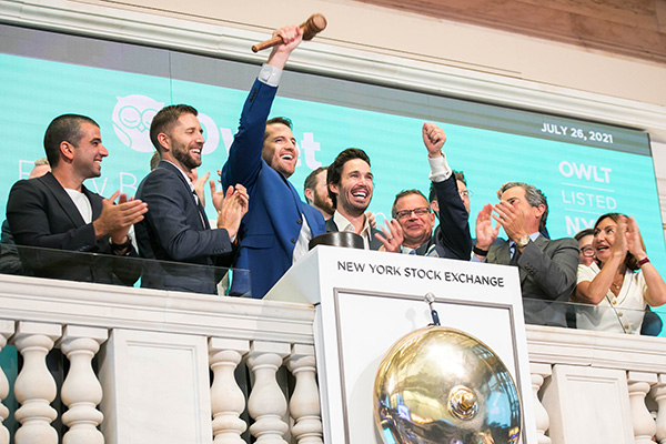 Kurt Workman and the Owlet Baby Care team celebrates above the NYSE bell.