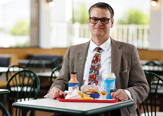 Folklore professor Eric ELiason with a tray of Utah's distinctive food items.