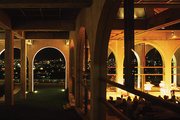 A photo from inside the BYU Jerusalem Center at night, overlooking the lights outside.