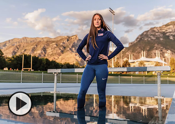 Former BYU track star Courtney Wayment stands in the water of a steeplechase hurdle pit. Photo by Bradley SLade.