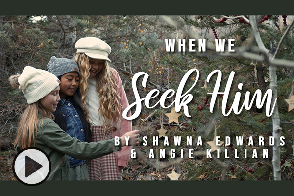 Three young girls gather outdoors by a tree decorated with Christmas stars. Text reads When We Seek HIm by Shawna Edwards and Angie Killian.