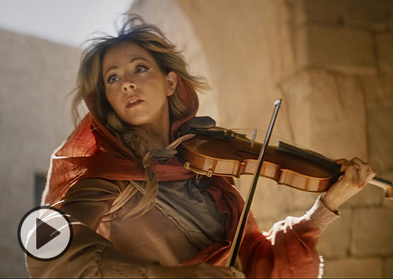 Lindsey Stirling with violin on the set of the Chosen.
