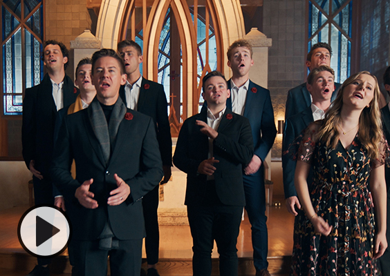 Mat and Savanna Shaw join BYU Vocal Point in front of an arched-window backdrop.