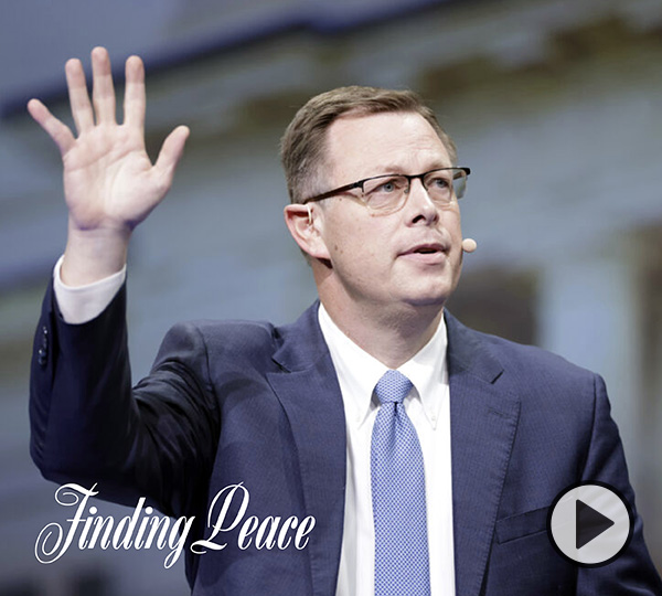 Elder Clark G. Gilbert assures his audience, gathered for the Feb. 8, 2022, devotional at Brigham Young University, that Christ can deliver peace during perilous times. Photo by BYU Photo.