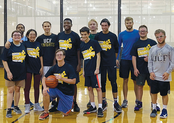 Thomas Knapp and his Special Olympics basketball team pose with pride after winning the intramural championship. Knapp, a medical student at UCF, finds time to serve his community while working on his degree. Photo by Elise Pulido Knapp.