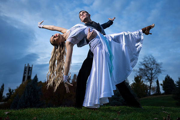 BYU ballroom dancers demonstrate a dance move on the grounds near the Bell Tower. Photo by Jaren Wilkey,