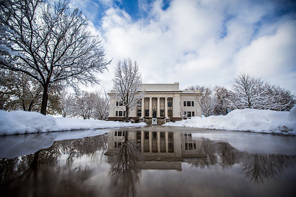 A wet and wintry view of the Karl G. Maeser building.