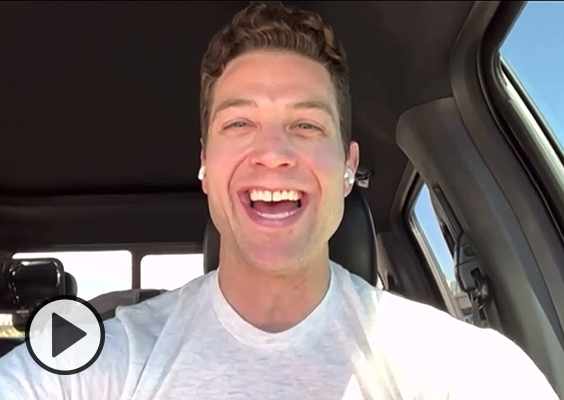 Jimmer Fredette with a huge smile and a great hair day takes a video call in his car.