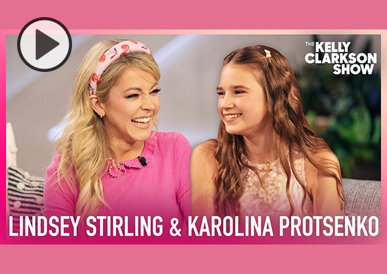 Lindsey Stirling and Karolina Protsenko smile and laugh on a recent appearance on the Kelly Clarkson Show.