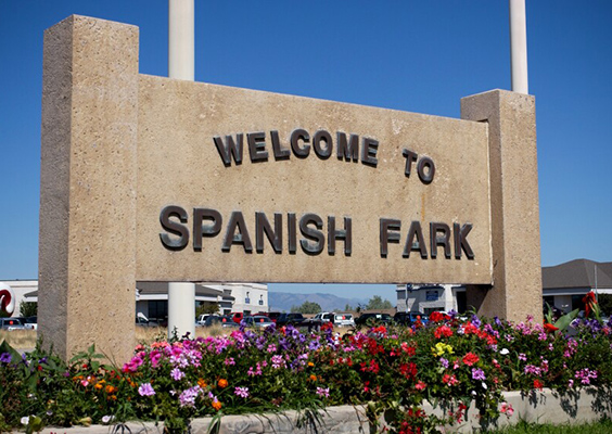 This photo illustration shows a city entrance sign that says Welcome to Spanish Fark.