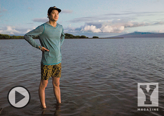 BYU biology student Kalai Ellis stands ankle deep in the coastal waters of Molokai.
