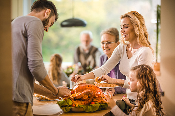 A family gathers for a turkey dinner.