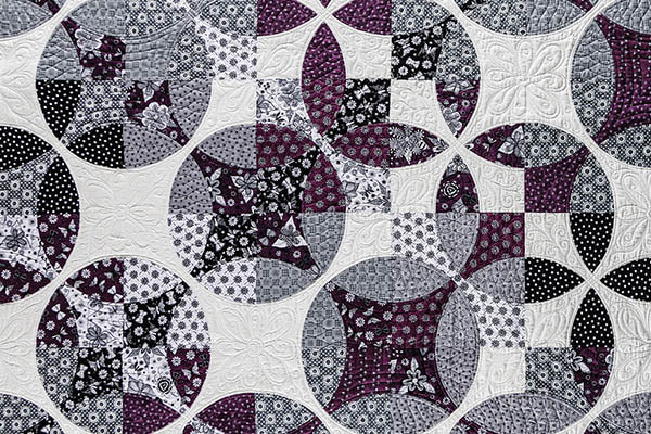 Bourdeaux & Gris is teh name of this quilt created by the award-winning artist Marie Nelson.