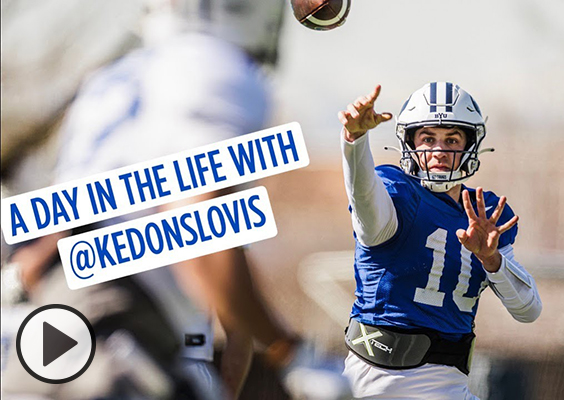 BYU quarterback Kedon SLovis, in full blue football gear, throws a football. A Day in teh Life with @KedonSLovis.