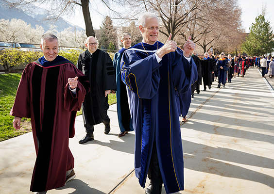 With big smiles Kevin Worthen and Shane Reese lead the graduation day processional.