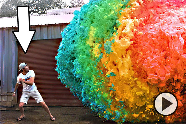 YouTuber Mark Rober is looking at and running from a rainbow colored explosion of goo.