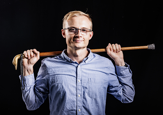 Brimhall essay contest winner Isaac Jacob Richards poses with a fashionable wooden cane.