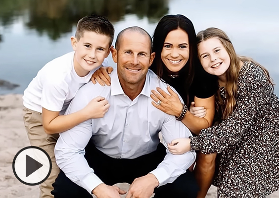 Max and McKenzi Hall pose with their two children.