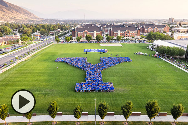 The incoming class of freshmen form a human Y in the field just north of Heritage Halls.