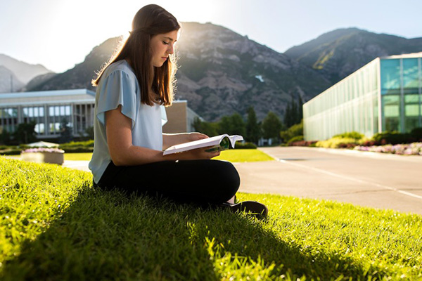 A BYU student studies as the sun comes up on campus. Photo by BYU Photo.